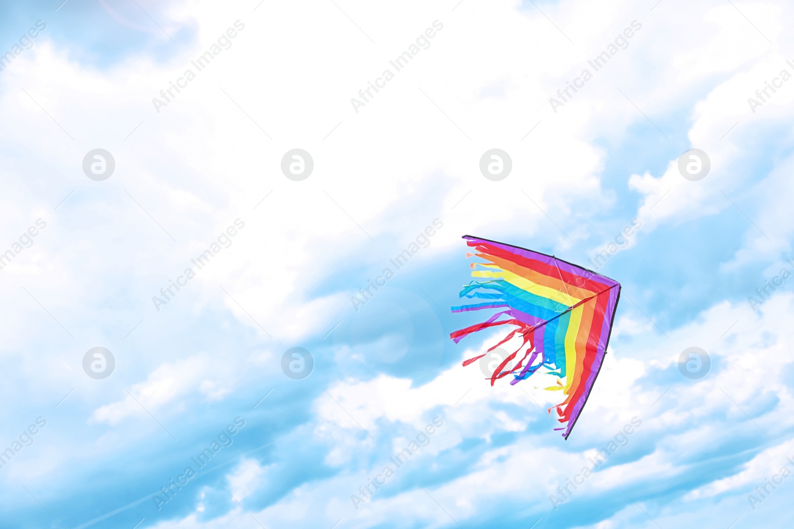 Photo of Beautiful kite drifting in blue sky