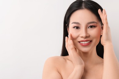 Portrait of beautiful woman on white background