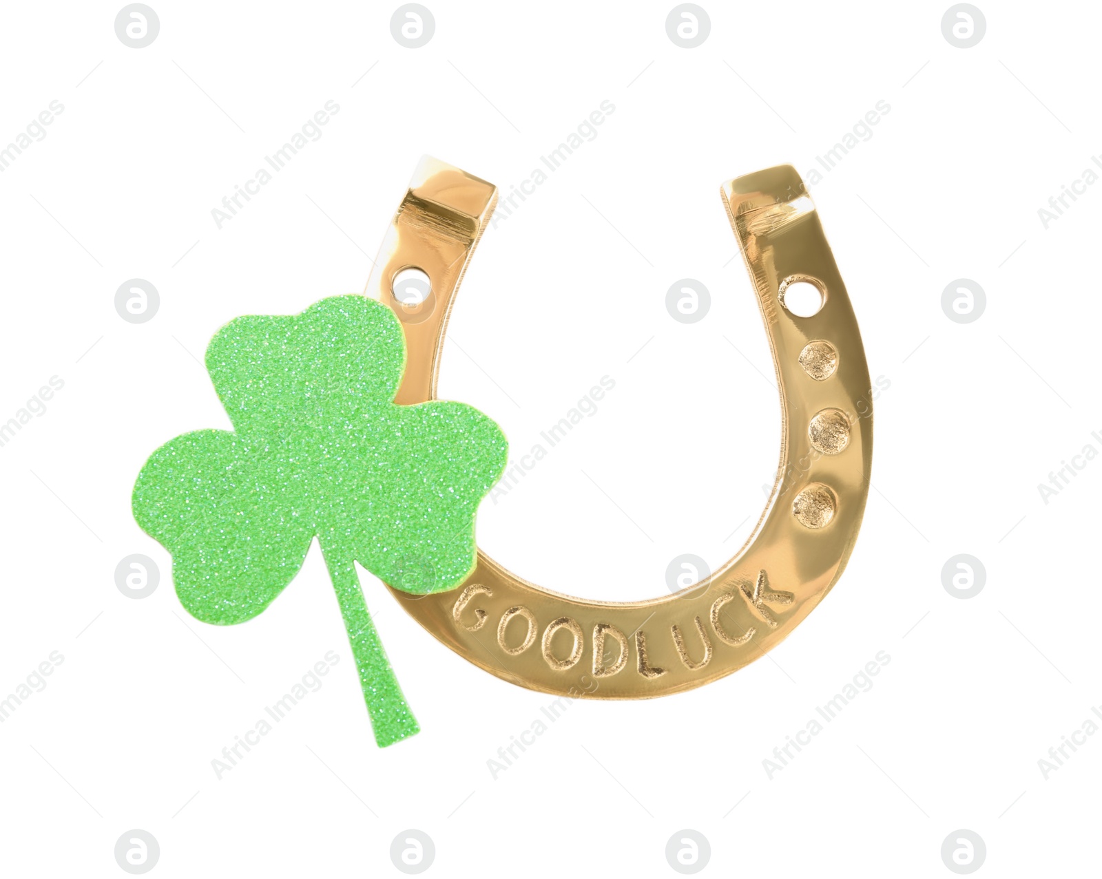 Photo of Golden horseshoe and decorative clover leaf on white background, top view. Saint Patrick's Day celebration