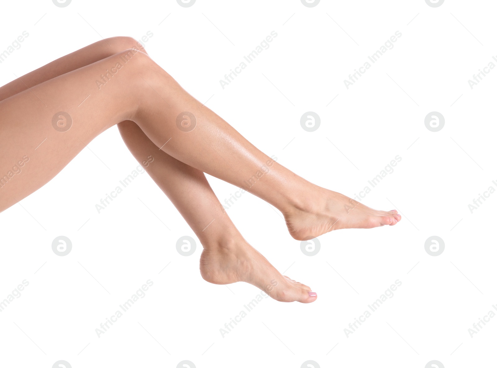 Photo of Woman with beautiful legs and feet on white background, closeup. Spa treatment