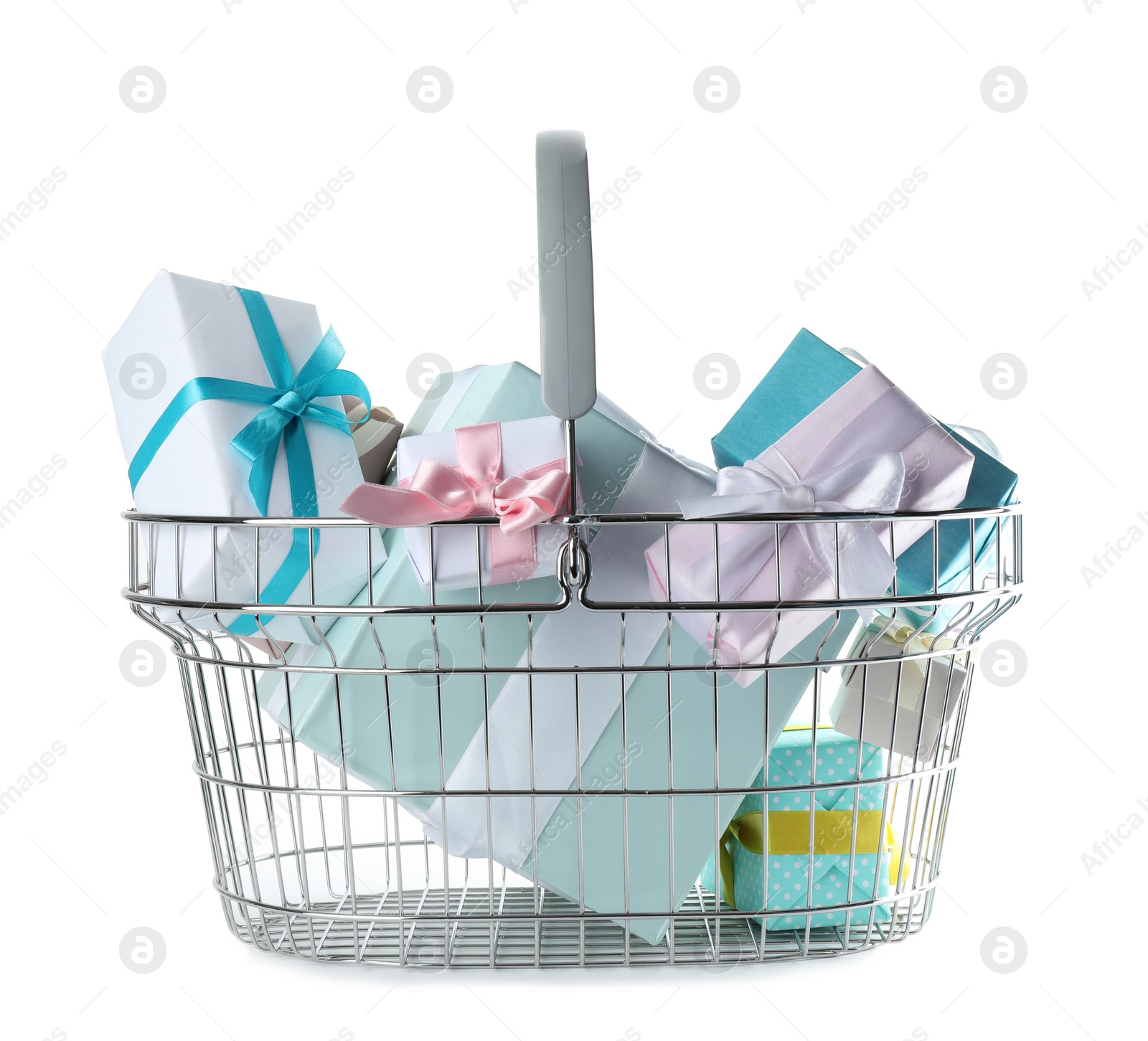 Photo of Shopping basket full of gift boxes on white background