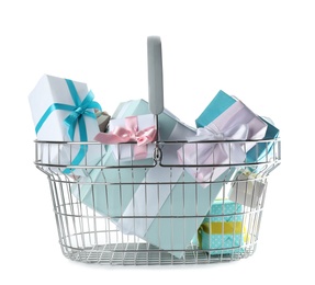 Photo of Shopping basket full of gift boxes on white background