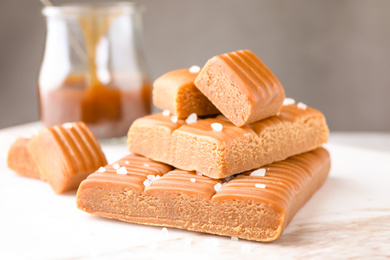 Photo of Salted caramel on white table, closeup view