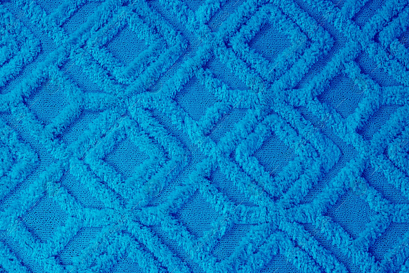 Image of Soft light blue carpet with pattern as background, top view