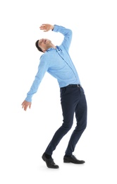 Emotional man in office wear posing on white background