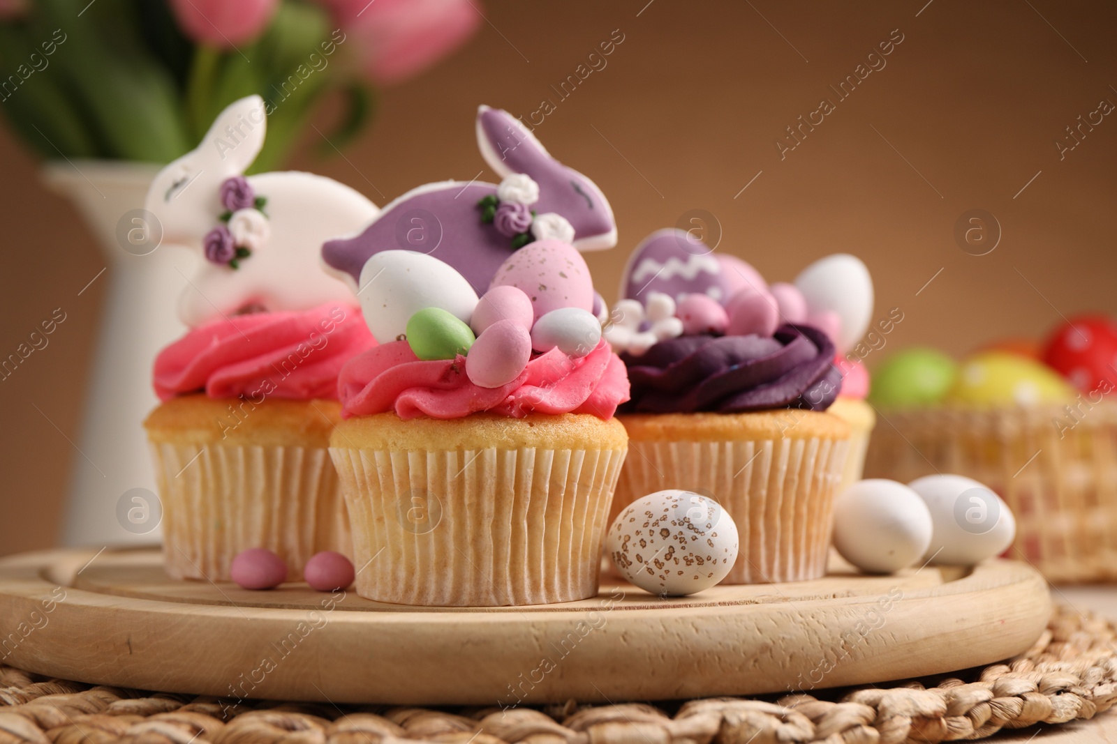 Photo of Tasty cupcakes with Easter decor on table