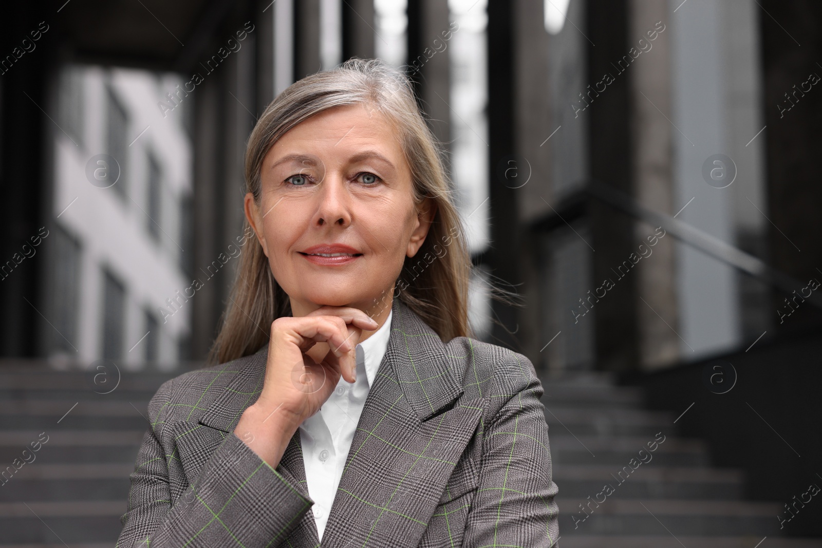 Photo of Portrait of beautiful woman outdoors. Lawyer, businesswoman, accountant or manager