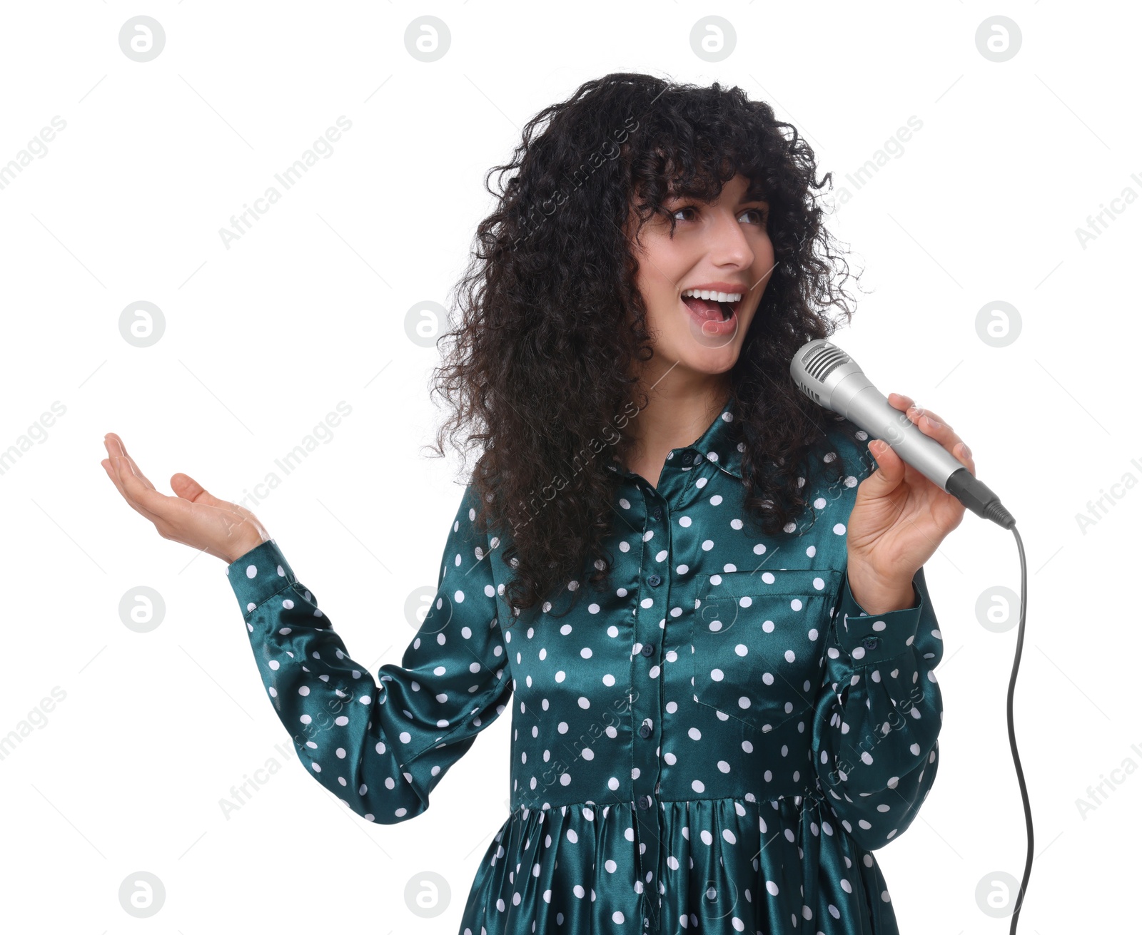 Photo of Beautiful young woman with microphone singing on white background