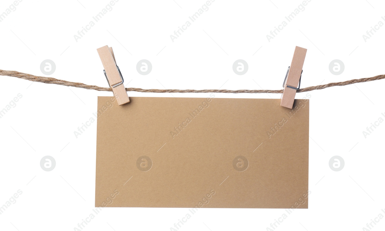 Photo of Clothespins with empty notepaper on string against white background. Space for text