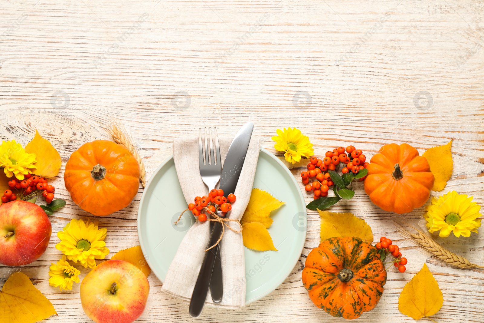 Photo of Flat lay composition with tableware, autumn fruits and vegetables on white wooden background, space for text. Thanksgiving Day