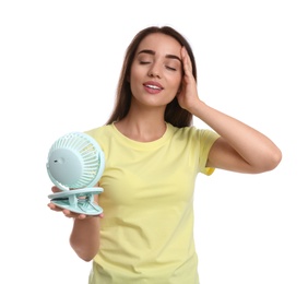 Photo of Woman enjoying air flow from portable fan on white background. Summer heat