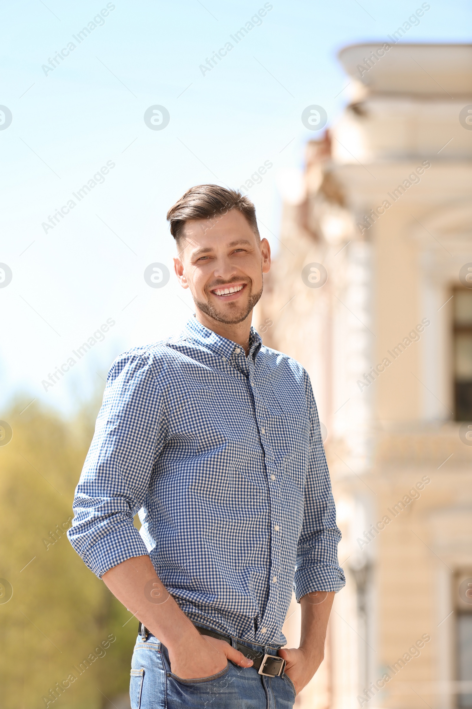 Photo of Portrait of young man in stylish outfit outdoors