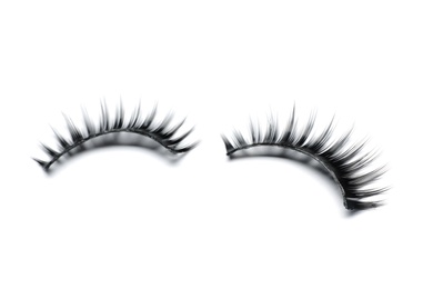 Photo of Beautiful pair of false eyelashes on white background