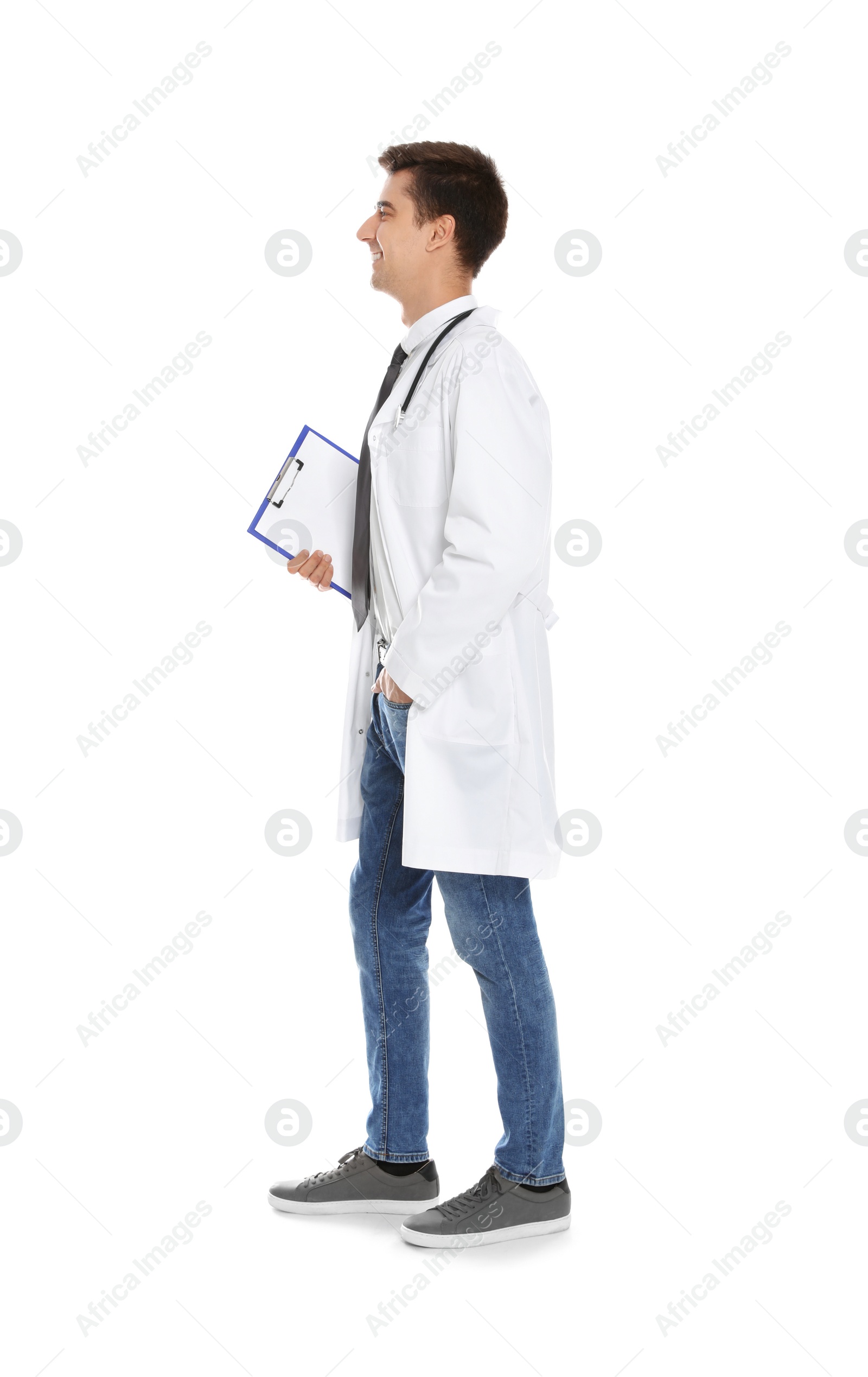 Photo of Full length portrait of medical doctor with clipboard and stethoscope isolated on white