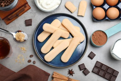 Flat lay composition with ingredients for tiramisu on grey table