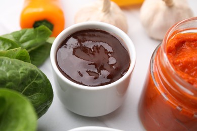 Photo of Fresh homemade marinade in bowl on table, closeup