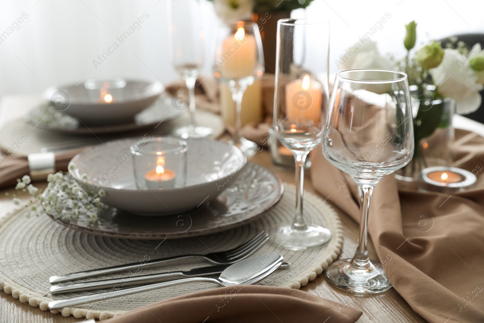 Photo of Festive table setting with beautiful floral decor in restaurant