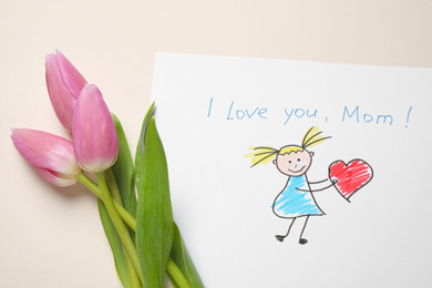 Photo of Drawing for Mother's day and beautiful tulips on beige background, flat lay
