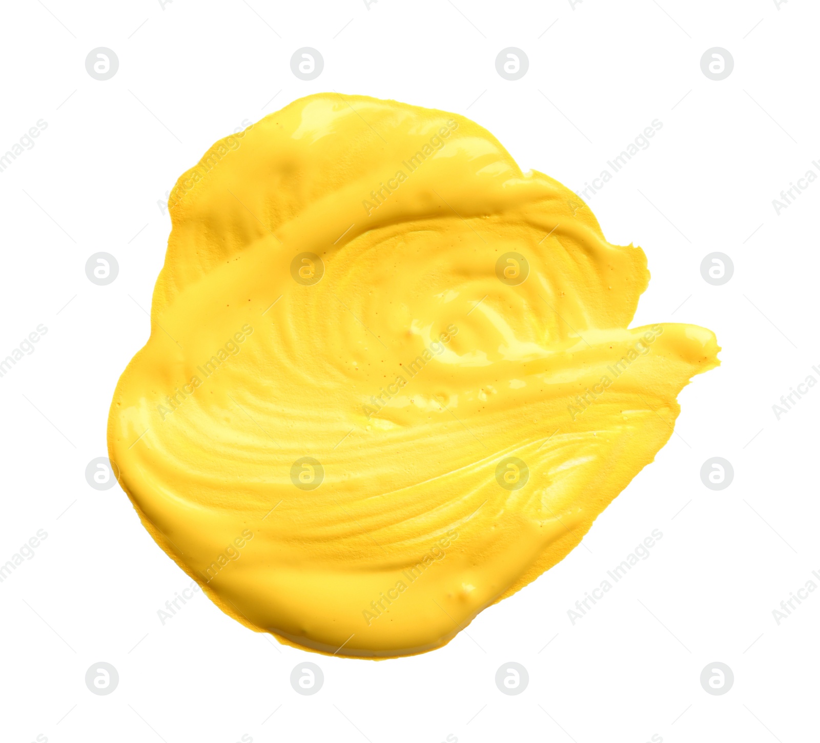 Photo of Abstract brushstroke of yellow paint isolated on white