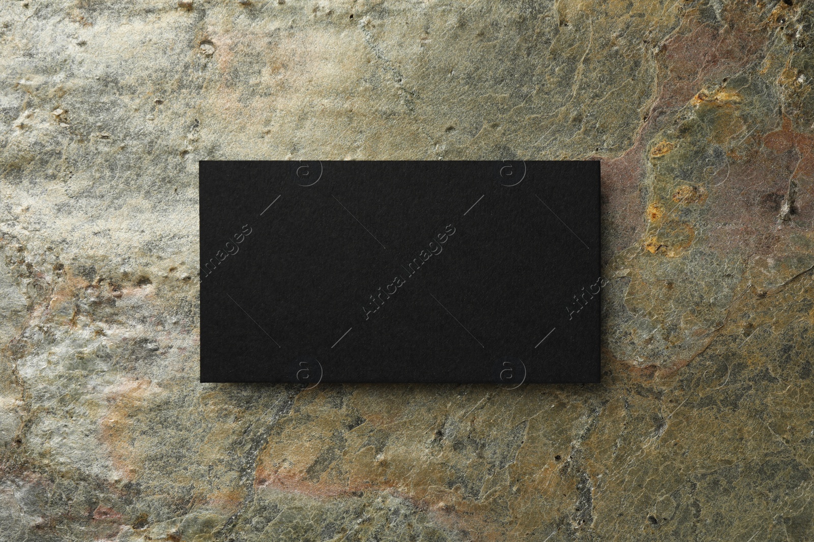 Photo of Blank business card on stone background, top view. Mockup for design