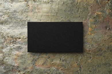 Photo of Blank business card on stone background, top view. Mockup for design