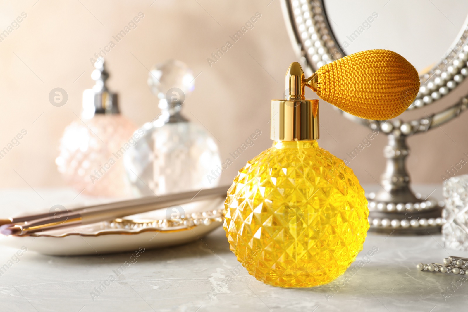 Photo of Different perfume bottles on dressing table, space for text