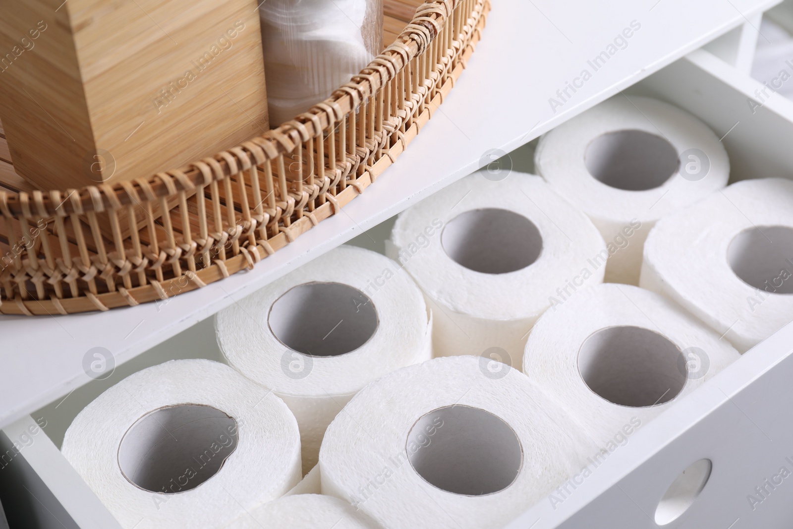 Photo of Many toilet paper rolls in white drawer indoors