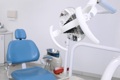 Photo of Dental operating lamp in clinic, space for text