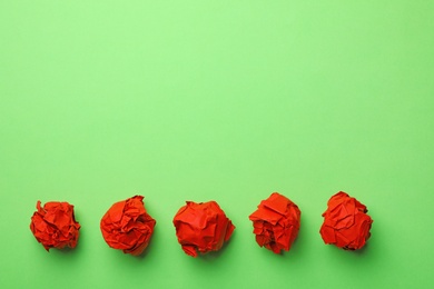 Photo of Paper balls on color background, flat lay. Space for text