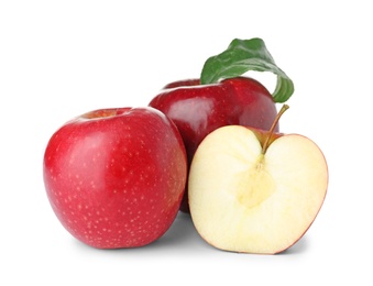 Photo of Cut and whole juicy apples on white background