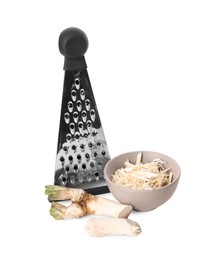 Bowl with grated horseradish, cut root and grater isolated on white