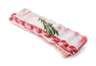 Photo of Raw pork ribs with rosemary isolated on white