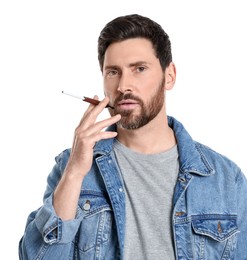 Photo of Man using cigarette holder for smoking isolated on white