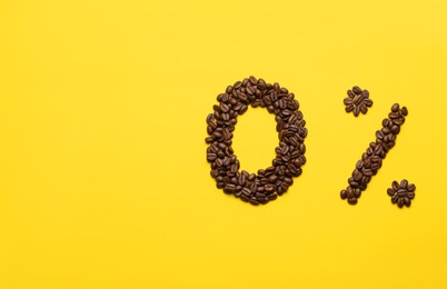 Photo of 0 percent made of coffee beans on yellow background, flat lay. Decaffeinated drink
