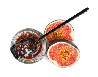 Photo of Glass jar of tasty sweet fig jam and spoon isolated on white, top view