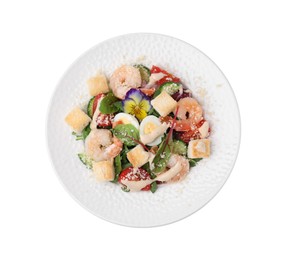 Plate of delicious Caesar salad with shrimps isolated on white, top view