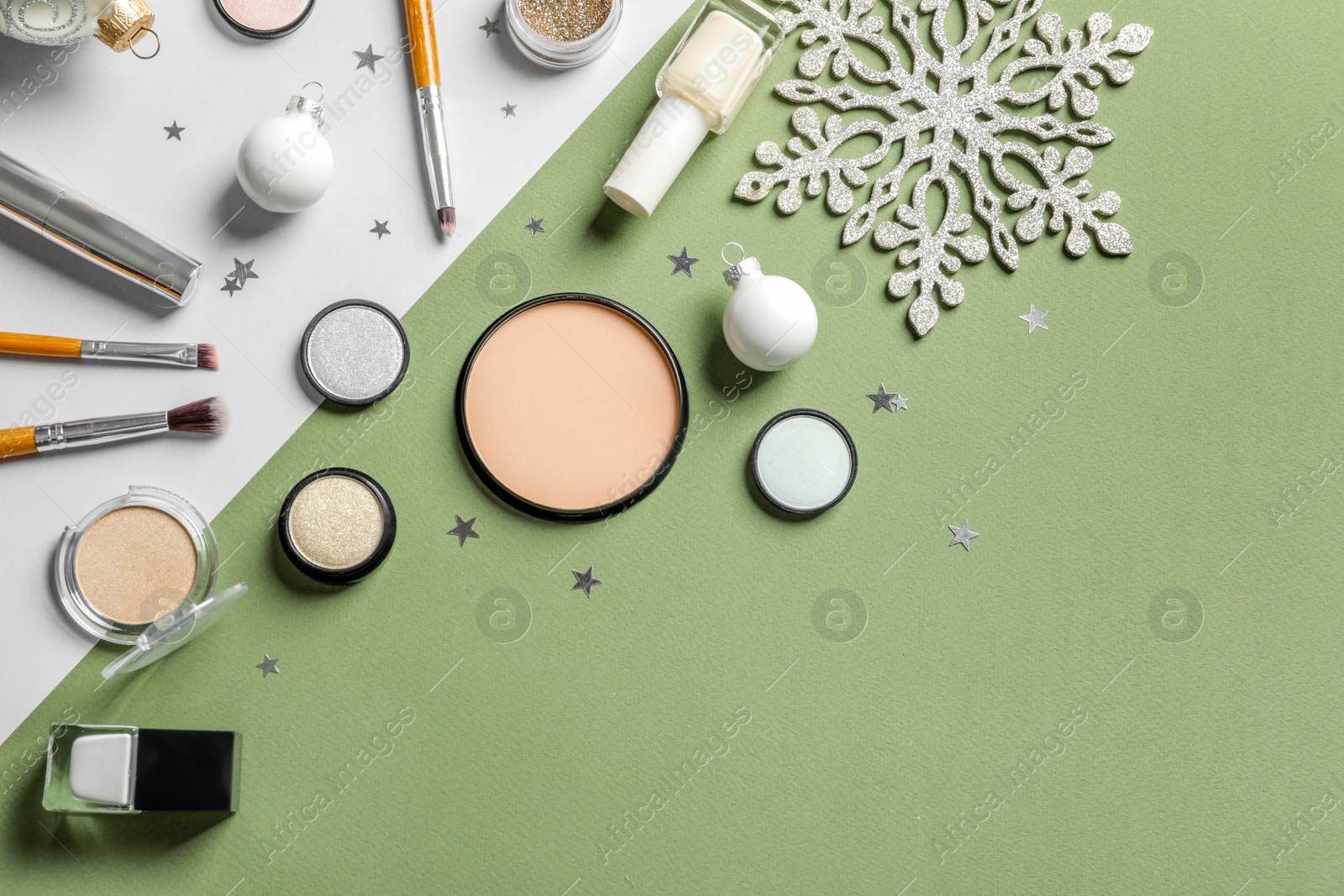 Photo of Flat lay composition with makeup products and Christmas decor on color background. Space for text