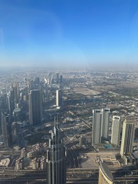 Photo of Dubai, United Arab Emirates - May 2, 2023: Picturesque view of city with skyscrapers from Burj Khalifa