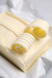 Photo of Tasty butter and curls on table, closeup