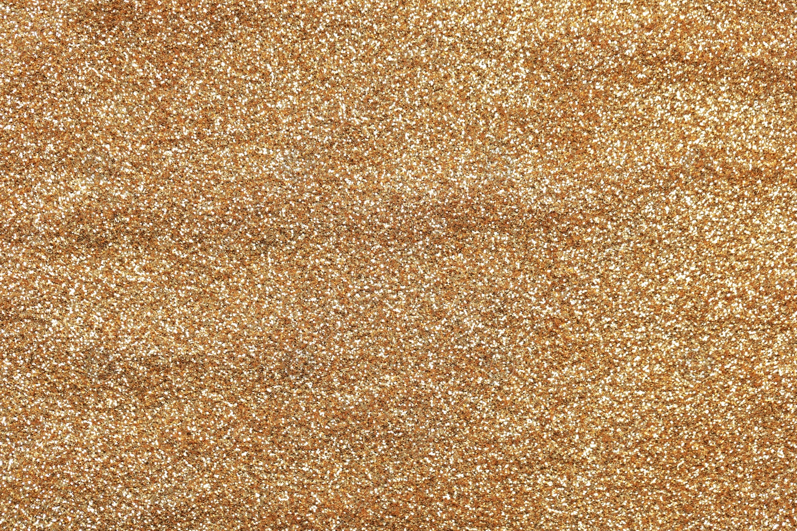 Photo of Beautiful golden shiny glitter as background, top view