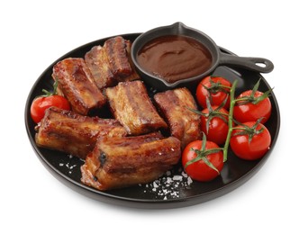 Photo of Tasty roasted pork ribs, sauce and tomatoes isolated on white