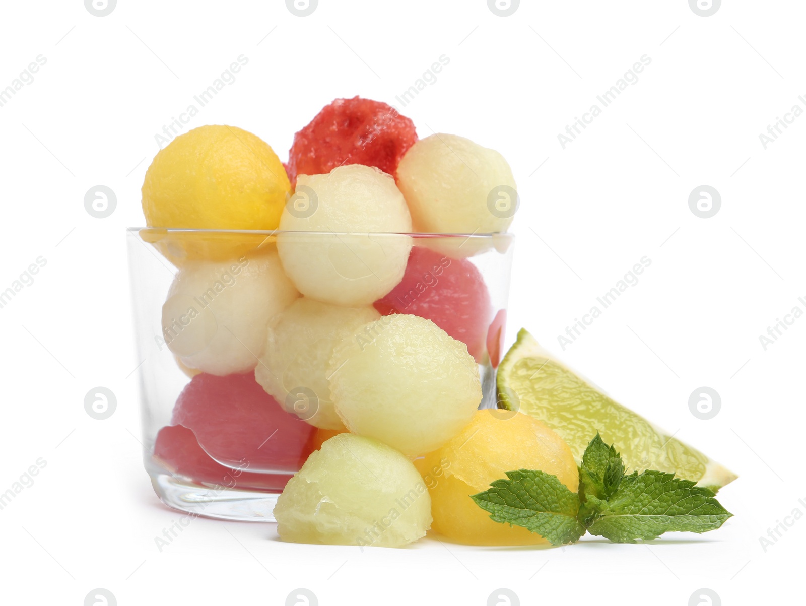 Photo of Glass of melon and watermelon balls with lime on white background