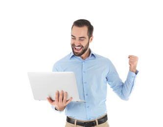 Photo of Emotional young man with laptop celebrating victory on white background