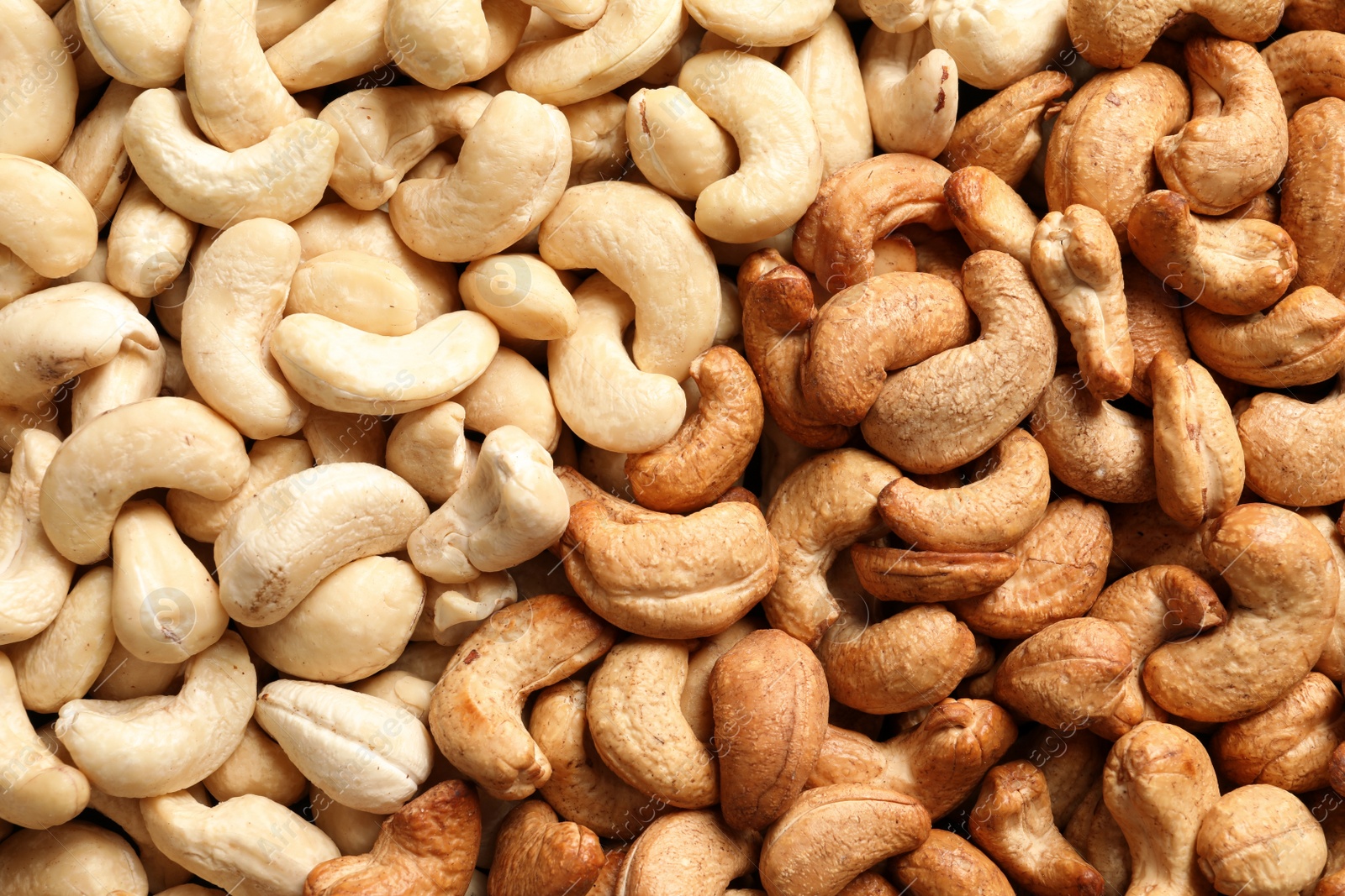 Photo of Tasty cashew nuts as background, top view