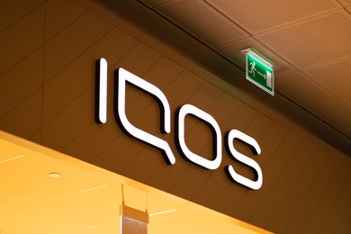 Warsaw, Poland - September 17, 2022: Signboard of Iqos store in shopping mall