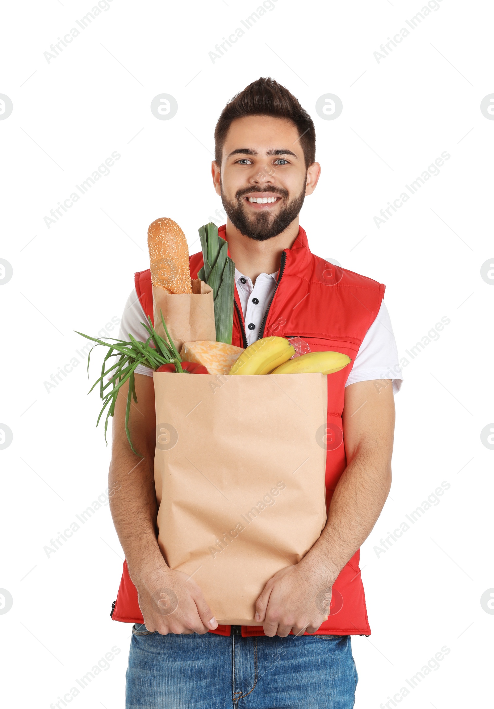 Photo of Man holding paper bag with fresh products on white background. Food delivery service