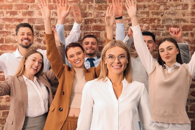 Photo of Businesswoman and her employees in office. Lady boss