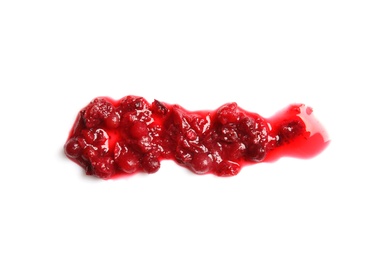 Photo of Spilled cranberry sauce on white background, top view