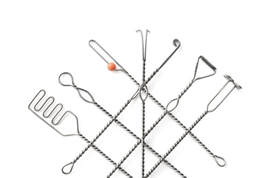 Set of logopedic probes on white background, top view. Speech therapist's tools