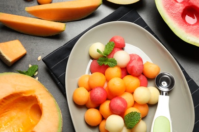Flat lay composition with melon and watermelon balls on table